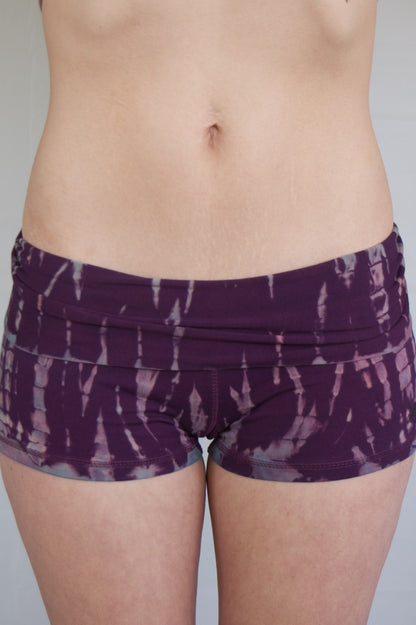 Lotus Tribe Clothing's curve hugging Amethyst tie dye shorts are purple with lavender highlights have a fold over waist are soft and comfortable. Ethically made of 90% cotton 10% spandex