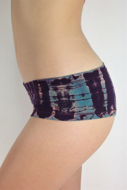 Side view of Amethyst Tie Dye Cheeky Undies. Purple tie dye with blue highlights. Super soft 90% cotton 10% spandex with lotus flower embroidery on left leg.