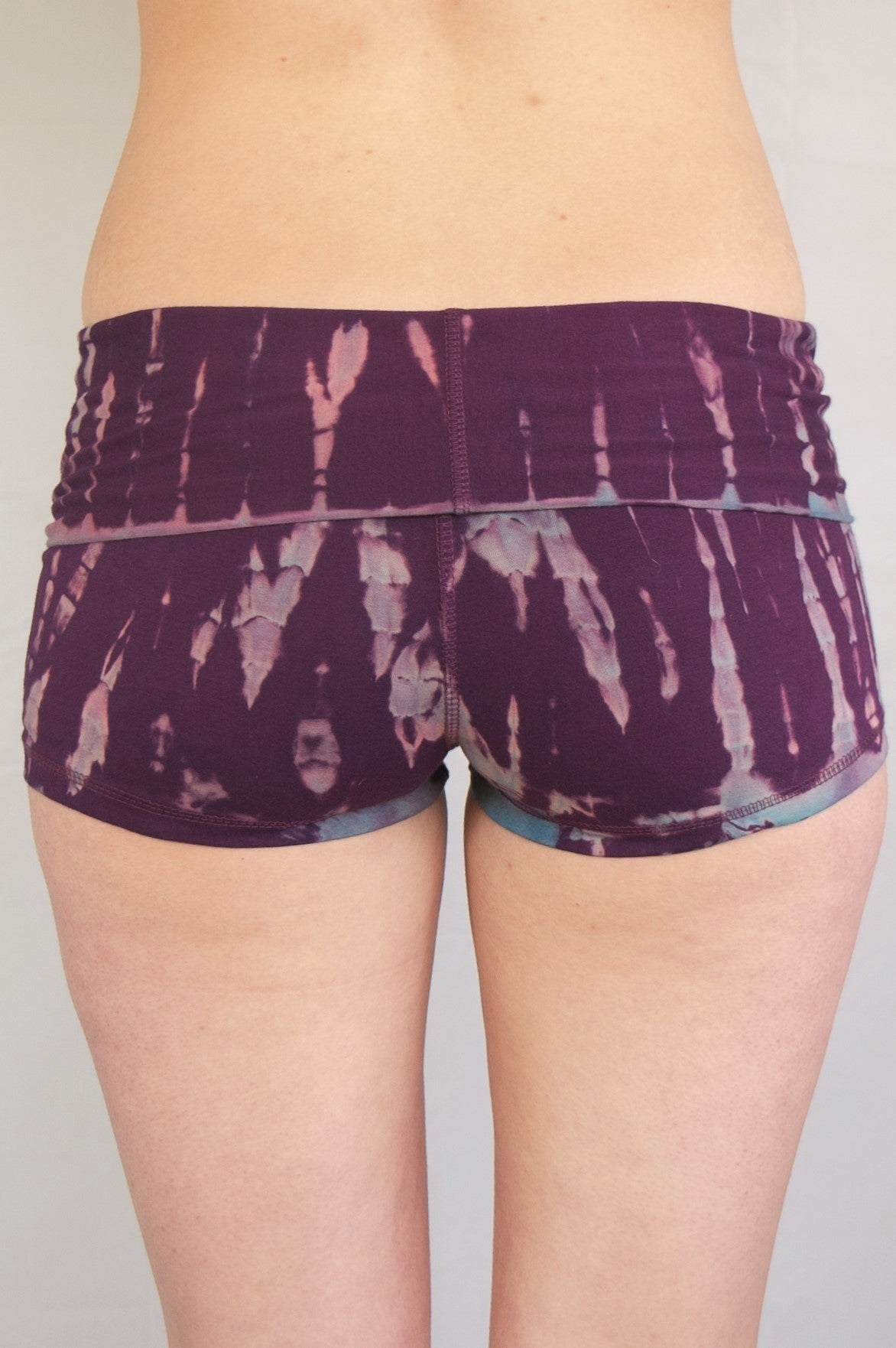 Purple tie dye yoga shorts lighter lavender/blue streaks. Fold top waist. 