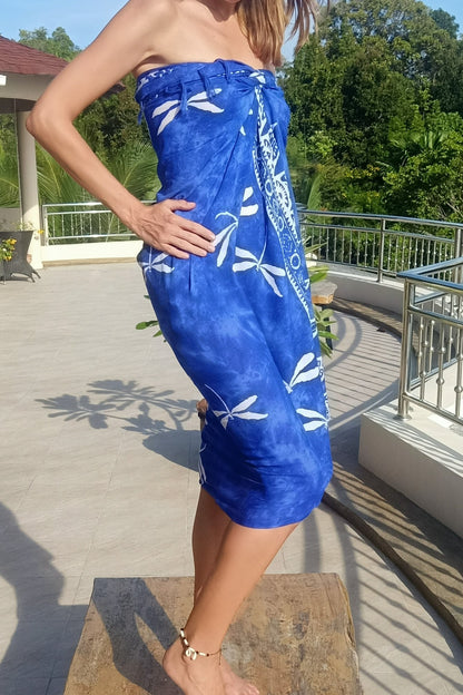 Wrap around sarong worn as dress. Blue with white dragonfly pattern. 