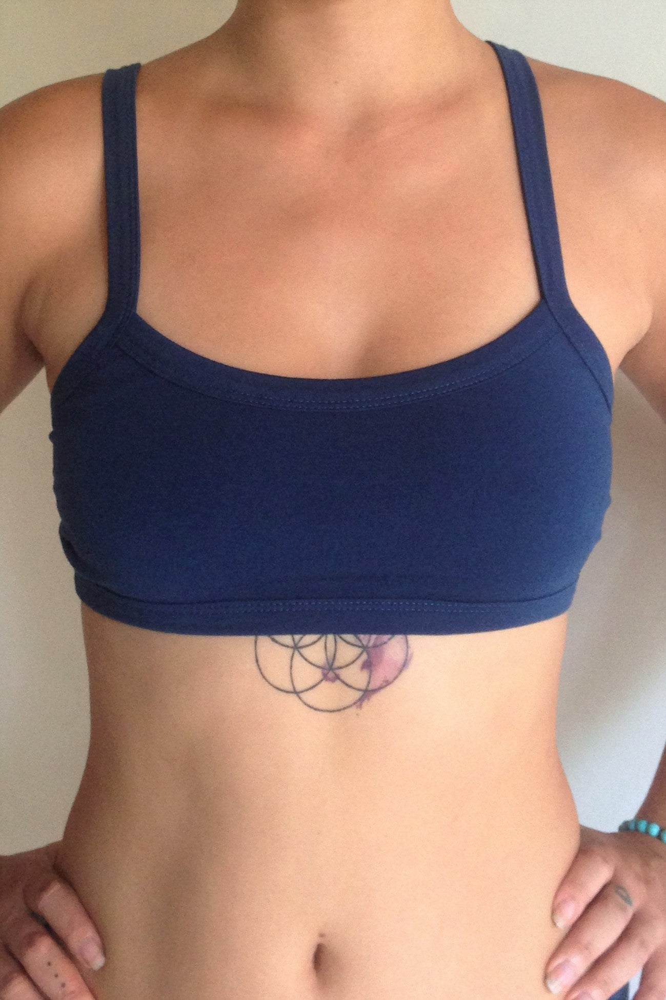 One of the most comfortable sports bras you will ever wear, soft and super cute. Solid Cobalt blue front with 3 horizontal straps across back. Medium support.