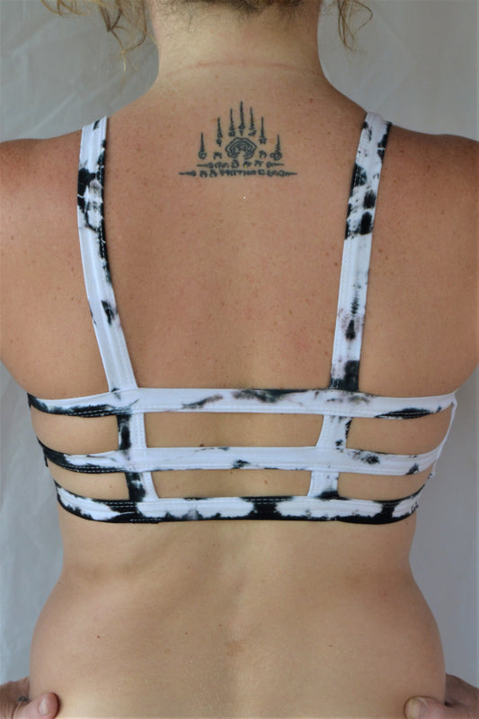 White with black tie dye sportsbra with three horizontal straps across the back. Incredibly comfortable with lighter support. Super soft 90% cotton 10% spandex 