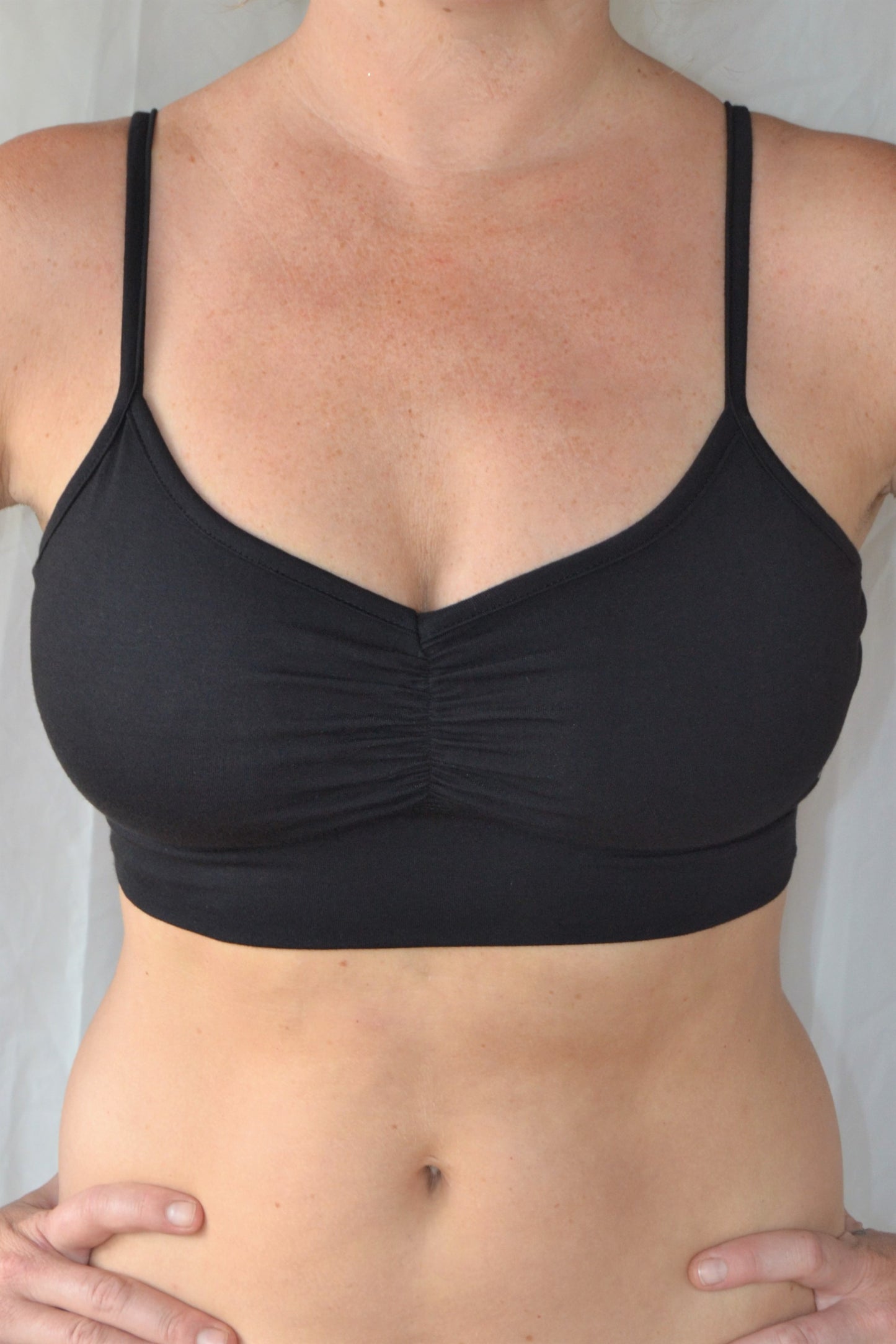 You'll be blissed out in this flattering Onyx (black) bra with adjustable spaghetti straps and scrunched center puckering it will soon become your new favorite!