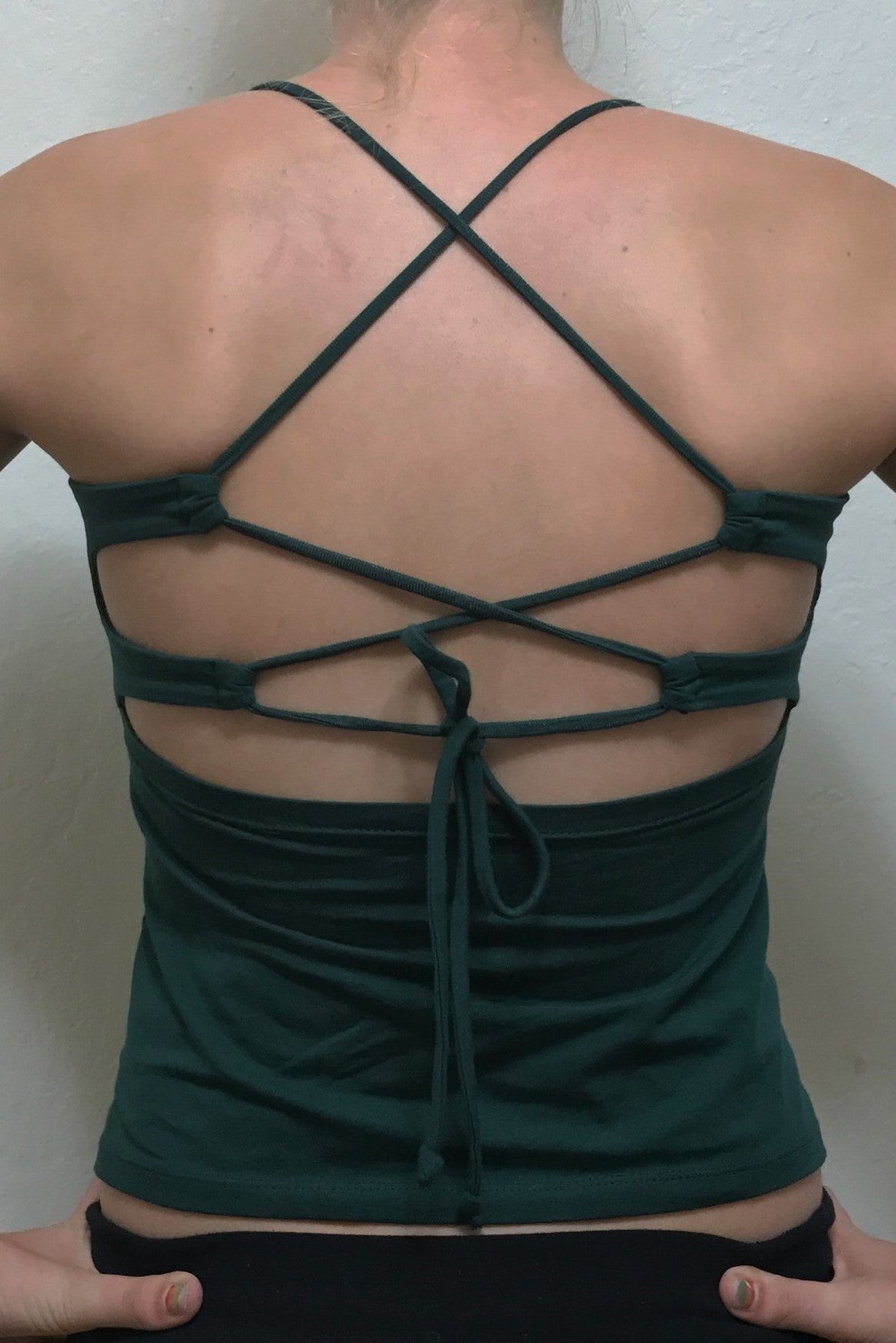 Back view of Forest green tank top with lace up back straps by Lotus Tribe Clothing