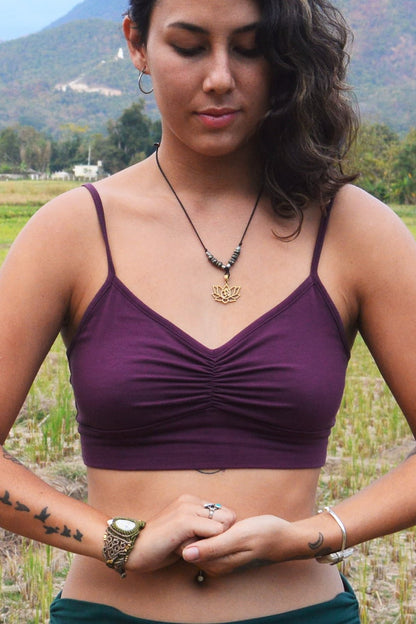 Front view of Plum Bliss Bralette, a purple bra with adjustable spaghetti straps and scrunched center puckering between the breasts. 90% cotton with 20% spandex.