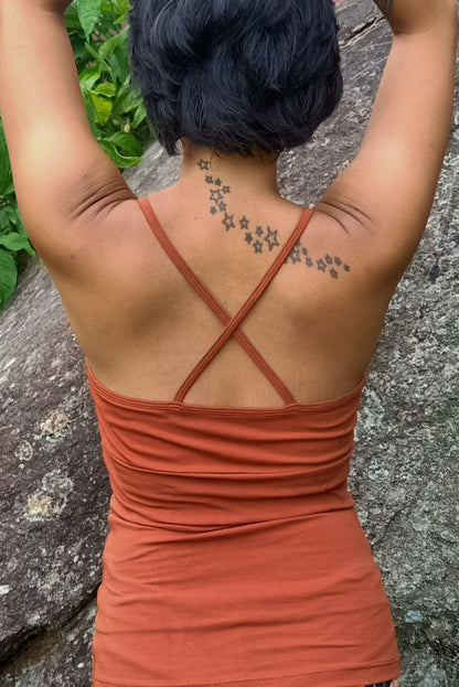 Back view of Ananda Tank in Rust shows spaghetti straps in X shape. Built in bra makes it perfect for yoga, exercise or everyday life. 90% cotton with 10%b spandex. 