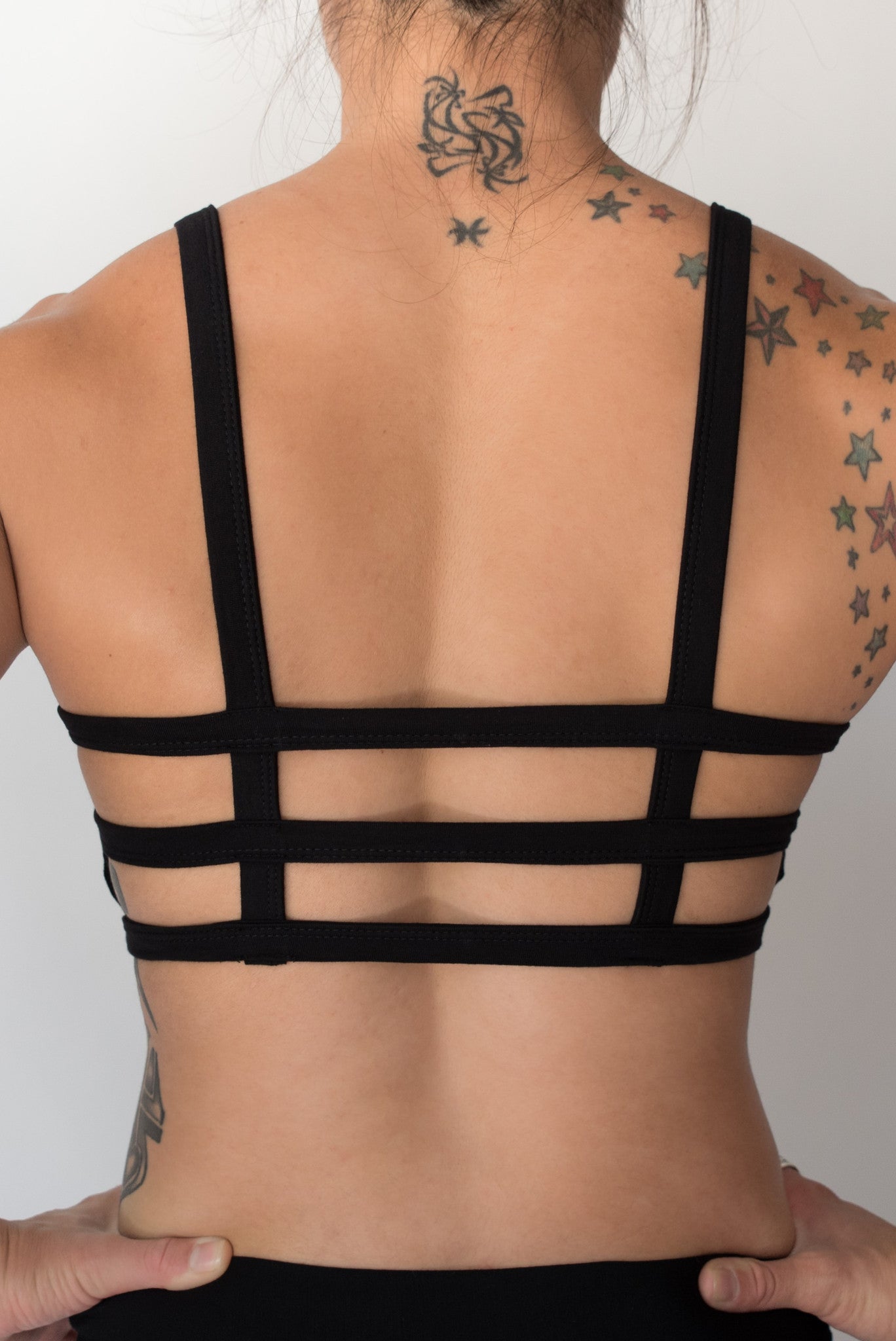 Back view of one of the most comfortable bras you will ever wear, soft and super cute with lighter support than our other bras. Solid front with 3 horizontal straps in back. 90% cotton 10% spandex. Made in Bali with love.