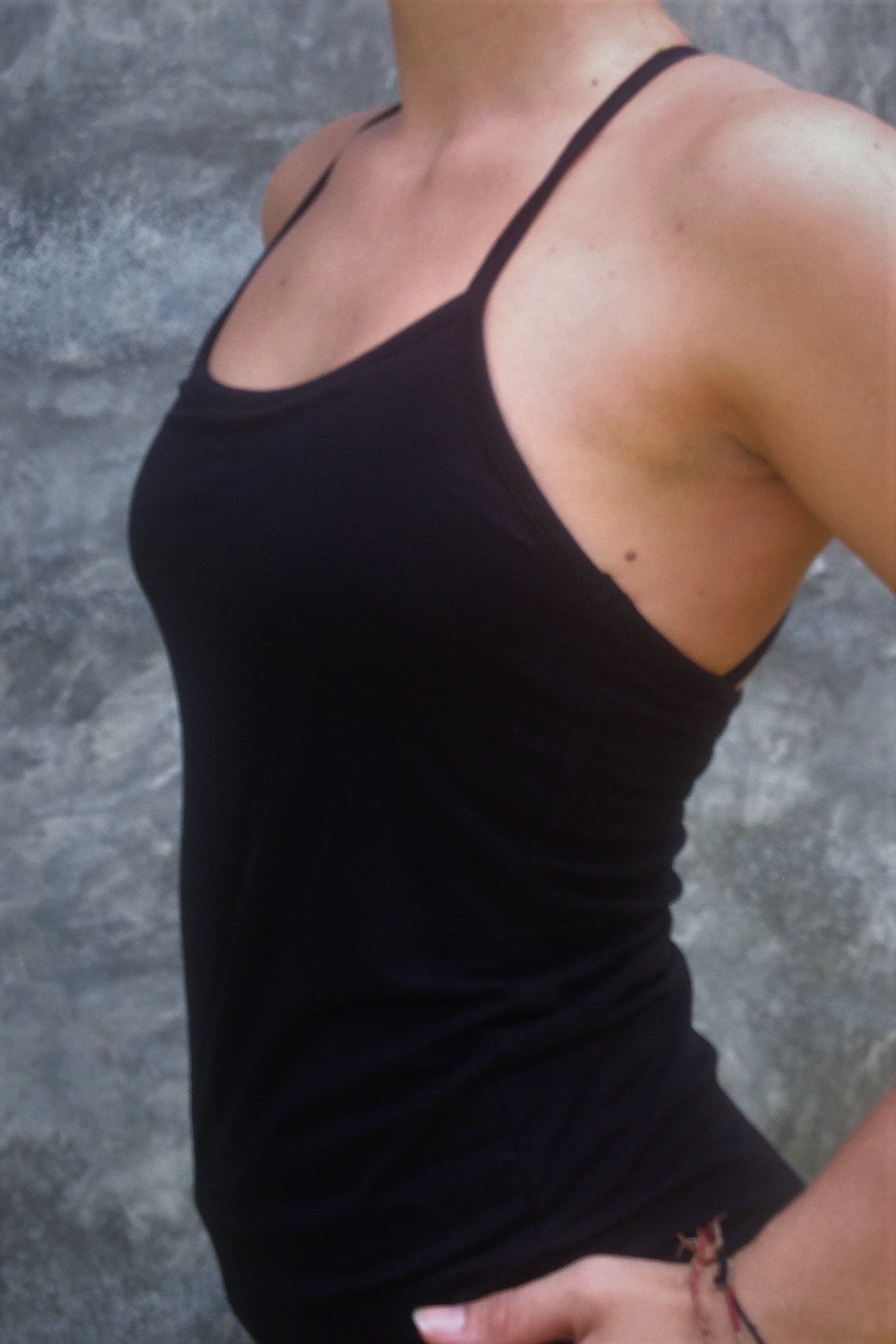 Side view of black Onyx Tank Top with spaghetti straps.